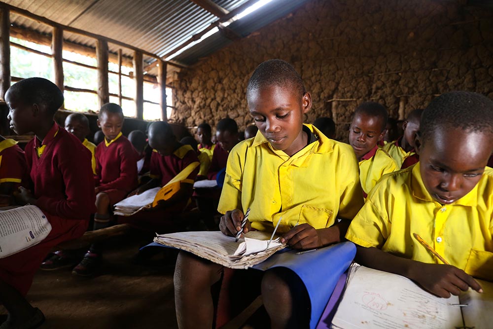 Ayubu studying in school after cleft surgery