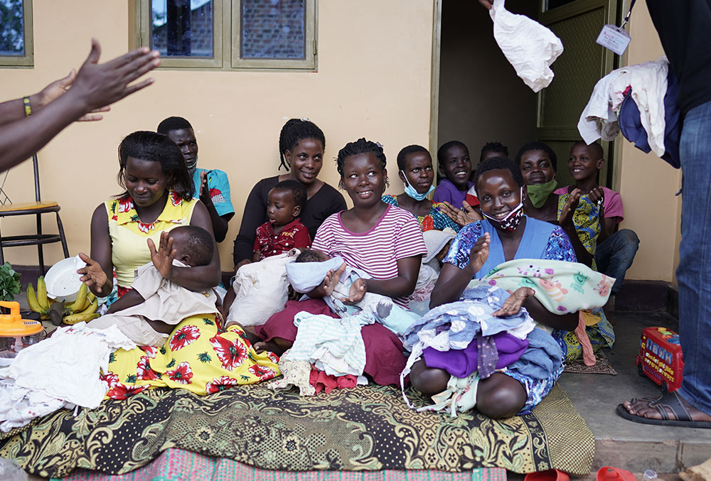 Patients of Sister Dr. Liliana Najjuka and their mothers smiling