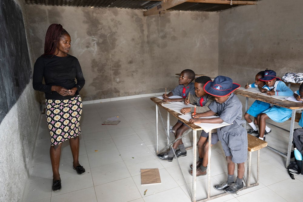 David studying in teacher Abigail's class after his cleft surgery