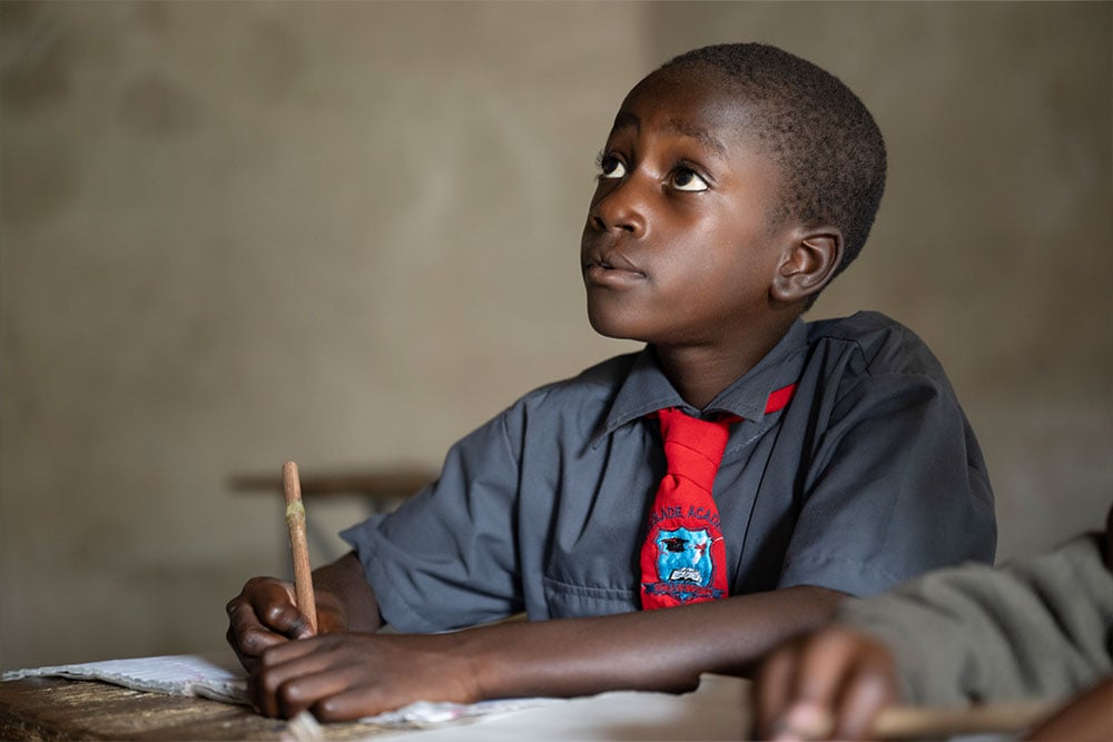 David studying in teacher Abigail's class after his cleft surgery