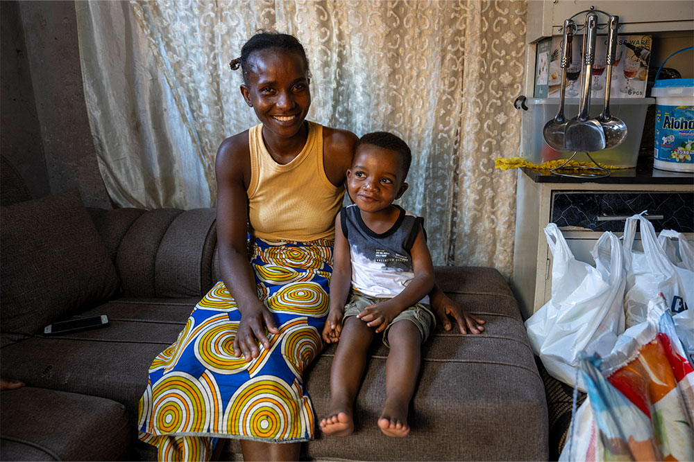 Joshua smiling with Josephine after his cleft surgery