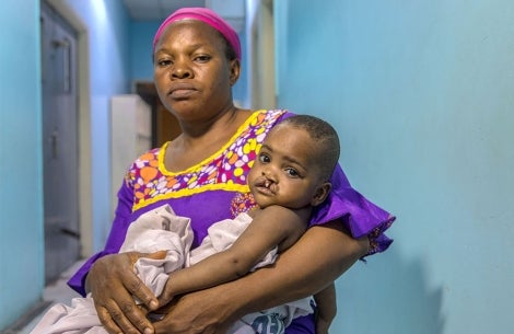 mother holds child needing surgery