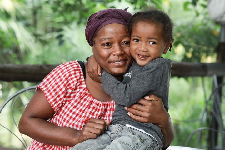 boy happy hugs mom