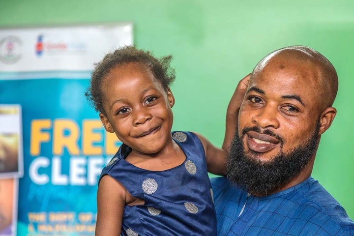 father holds daughter 