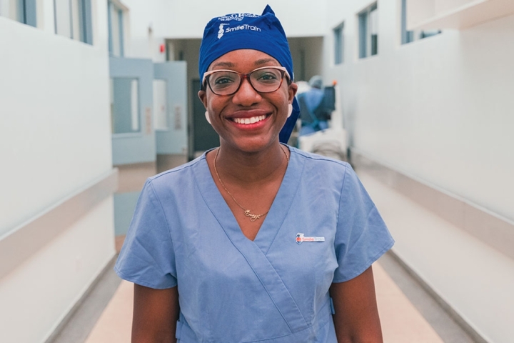 Dr. Elizabeth Igaga smiling in scrubs