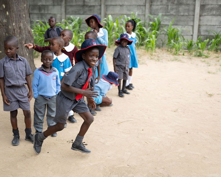 David running with his friends after cleft surgery